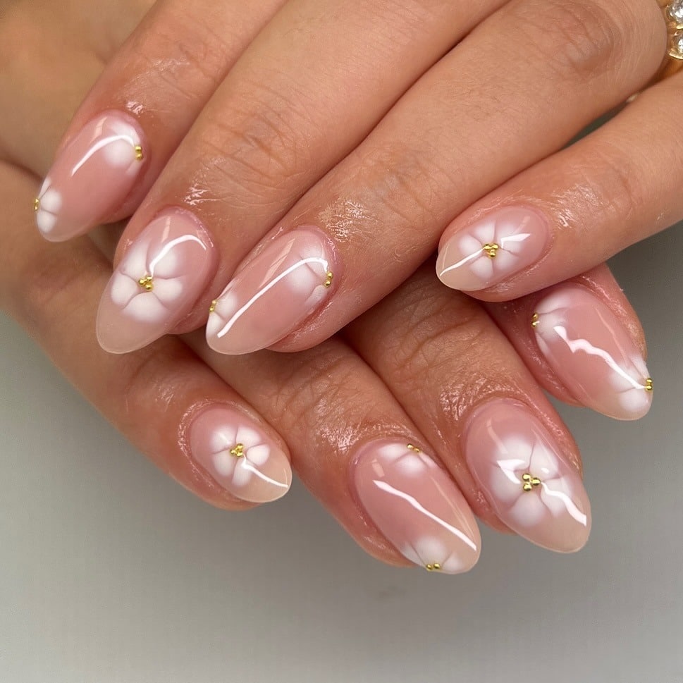 17. Milky Nude Almond Nails with Soft White Florals - cute nail ideas