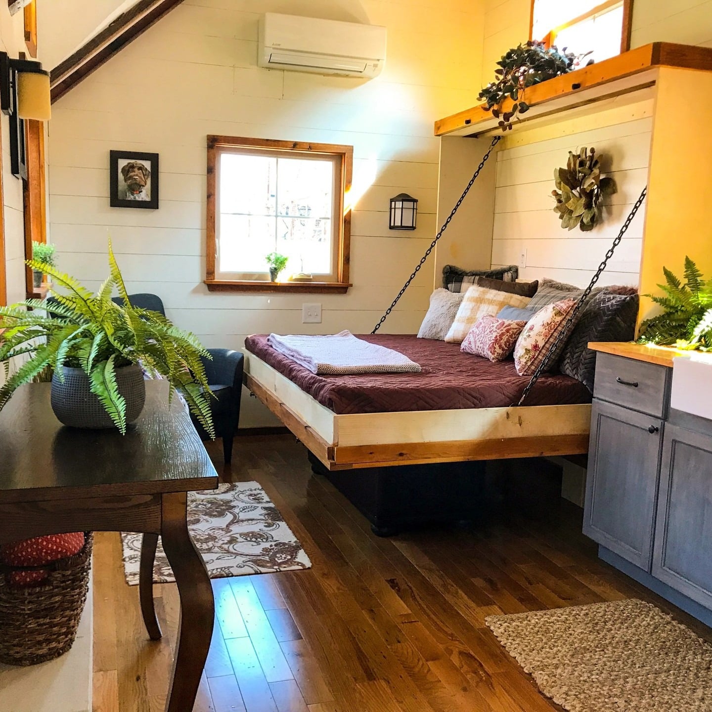 13. Rustic Cabin Bedroom with Warm Wood and Earthy Tones - tiny bedroom ideas