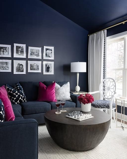 4. Midnight Blue Living Room with Modern Contrast Styling - blue living room ideas
