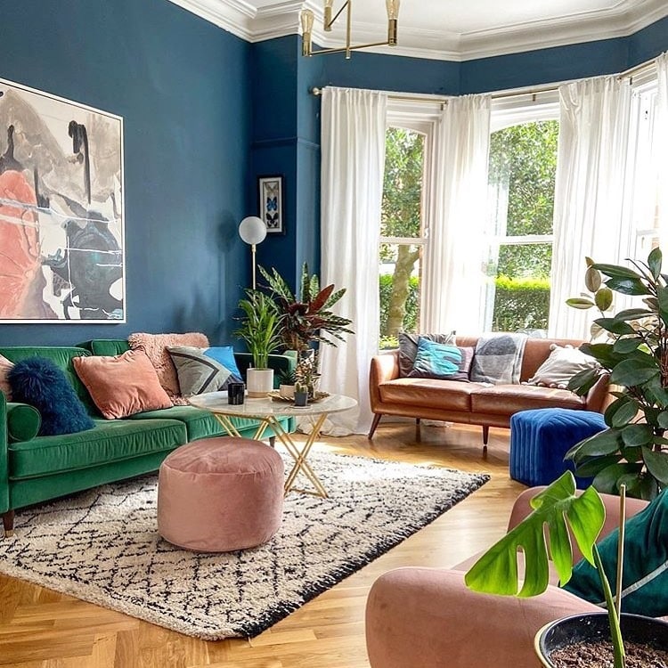 13. Bold Blue Living Room with Blush and Green Accents - blue living room ideas