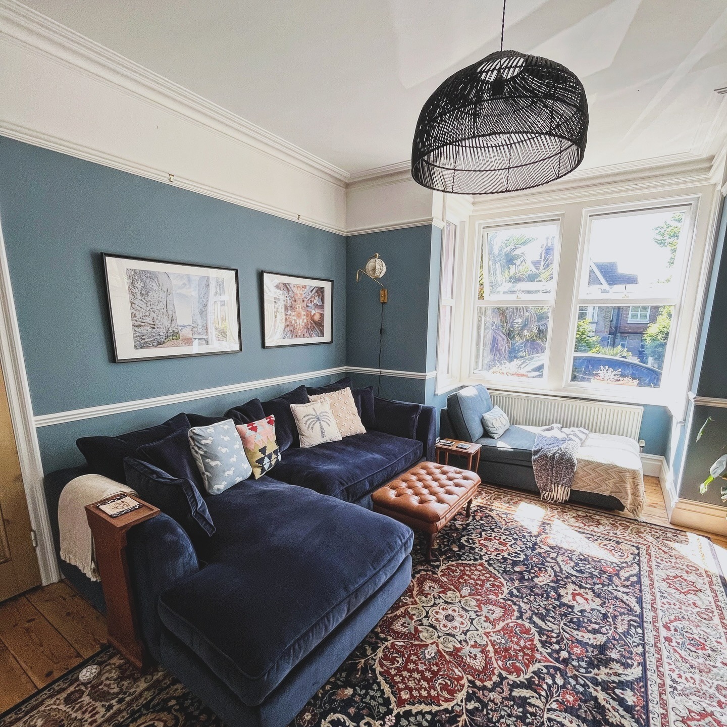 16. Soft Blue Living Room with Vintage Rug Character - blue living room ideas