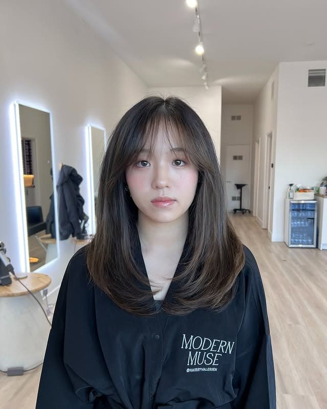 3. Cool-Toned Ash Brown Mid-Length Cut with Airy Wispy Bangs - Wispy Bangs Hairstyles