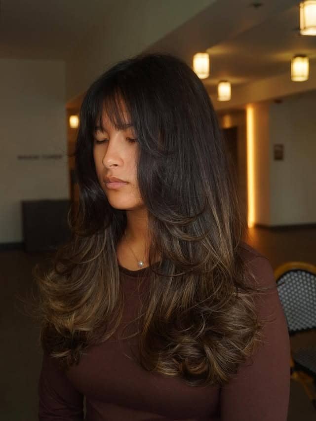 18. Light Ash Brown Shag-Inspired Layers with Wispy Bangs - Wispy Bangs Hairstyles