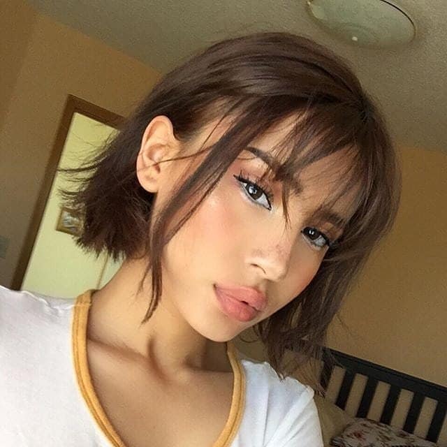 21. Textured Chocolate Brown French Bob with Wispy Bangs - Wispy Bangs Hairstyles