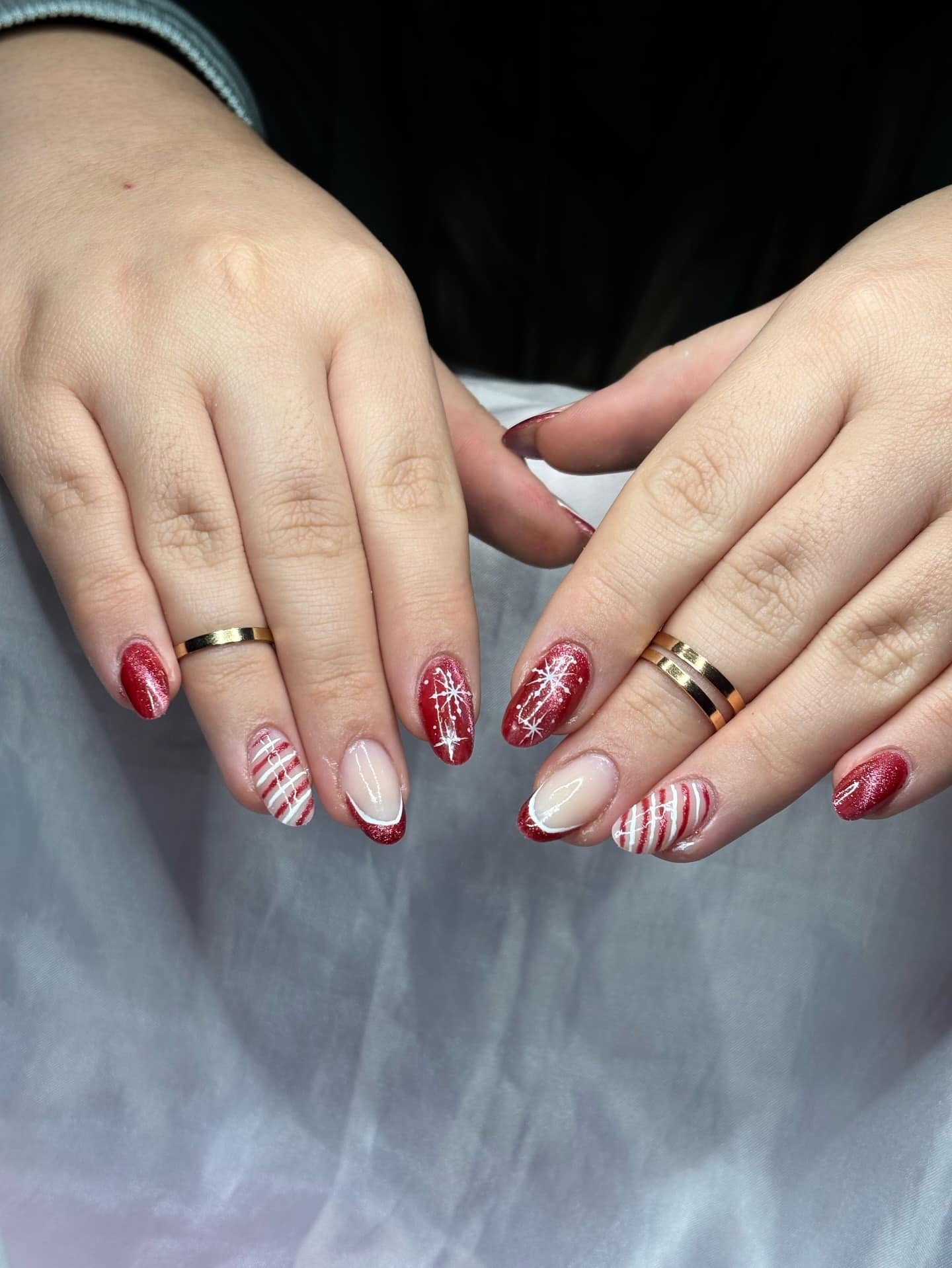 7. Classic Red Glitter Nails with Snowflake and Stripe Accents - christmas nail ideas