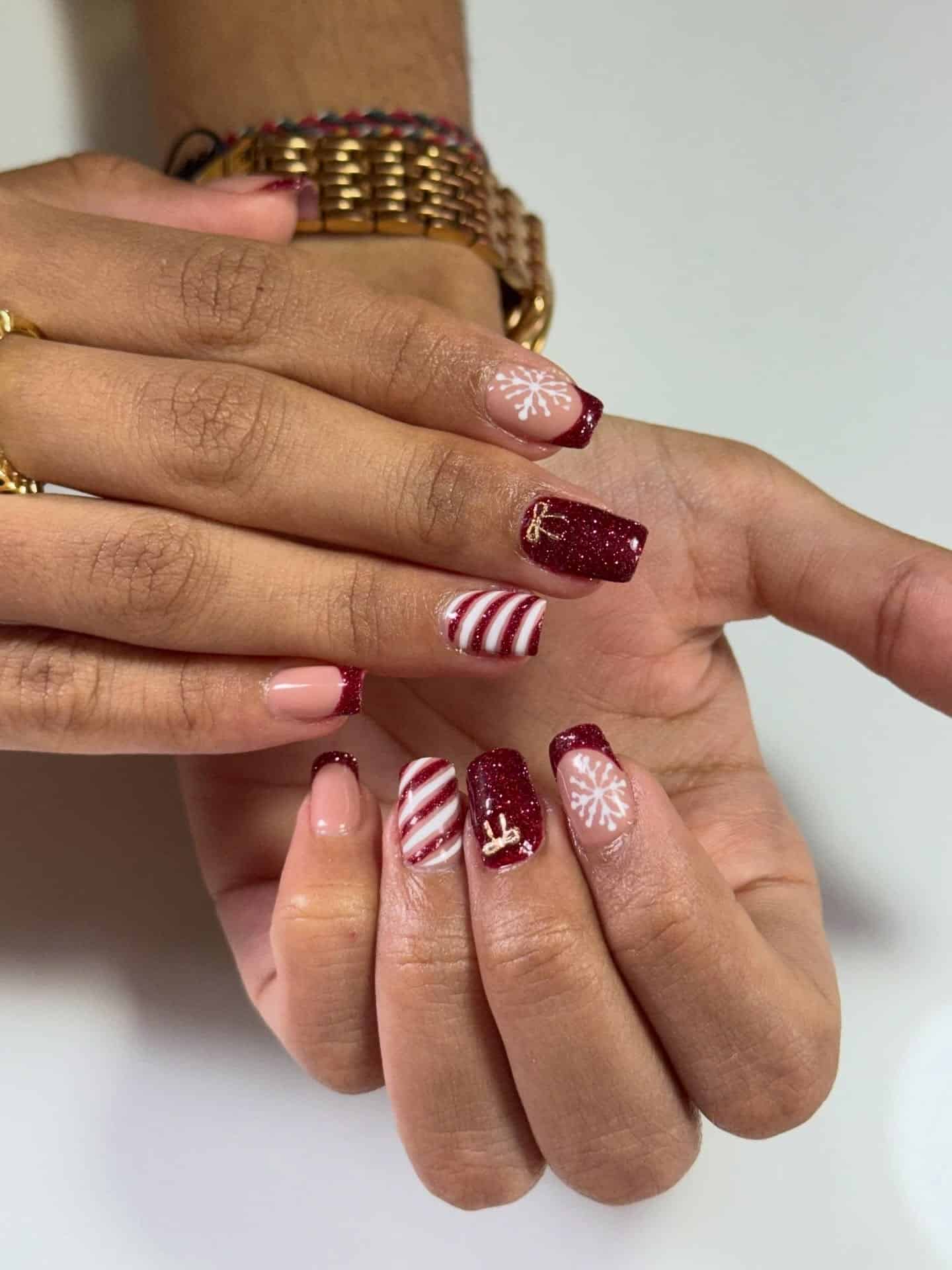 9. Short Square Red Glitter Nails with Snowflake Details - christmas nail ideas