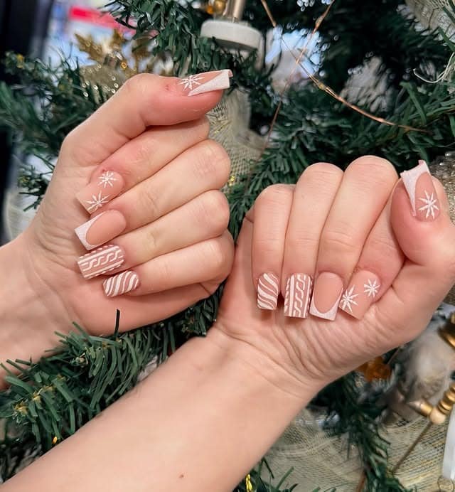 10. Neutral Knit Pattern Nails with White Snowflake Accents - christmas nail ideas