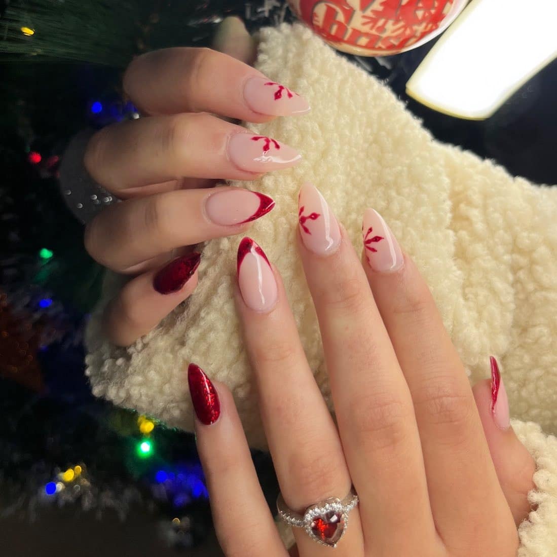15. Almond Nude Nails with Red Glitter Tips and Holly Details - christmas nail ideas