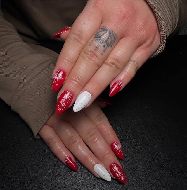 16. Stiletto Red and White Holiday Lettering Nails - christmas nail ideas