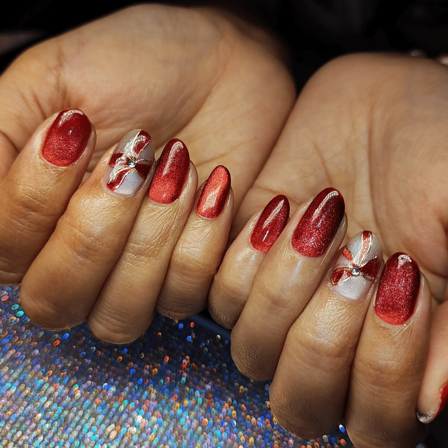 18. Red Chrome Almond Nails with Ribbon Accent Design - christmas nail ideas