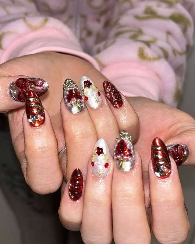 22. Red Chrome Stiletto Nails with 3D Holiday Embellishments - christmas nail ideas