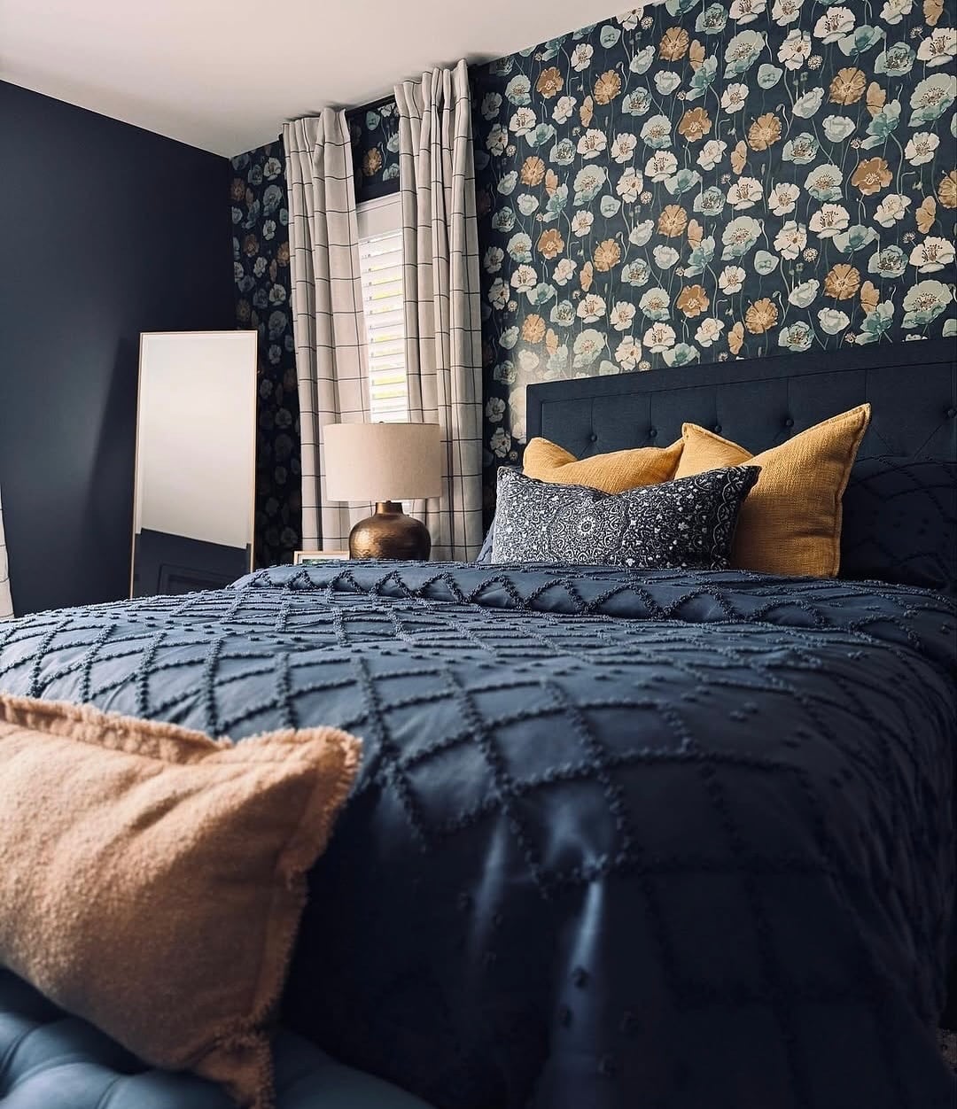 1. Navy Floral Accent Wall with Warm Ochre Layering - blue bedroom ideas