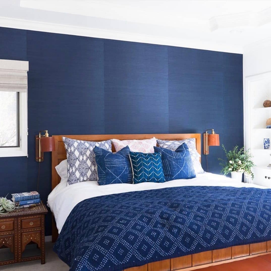 4. Deep Blue Panel Wall with Modern Contrast - blue bedroom ideas