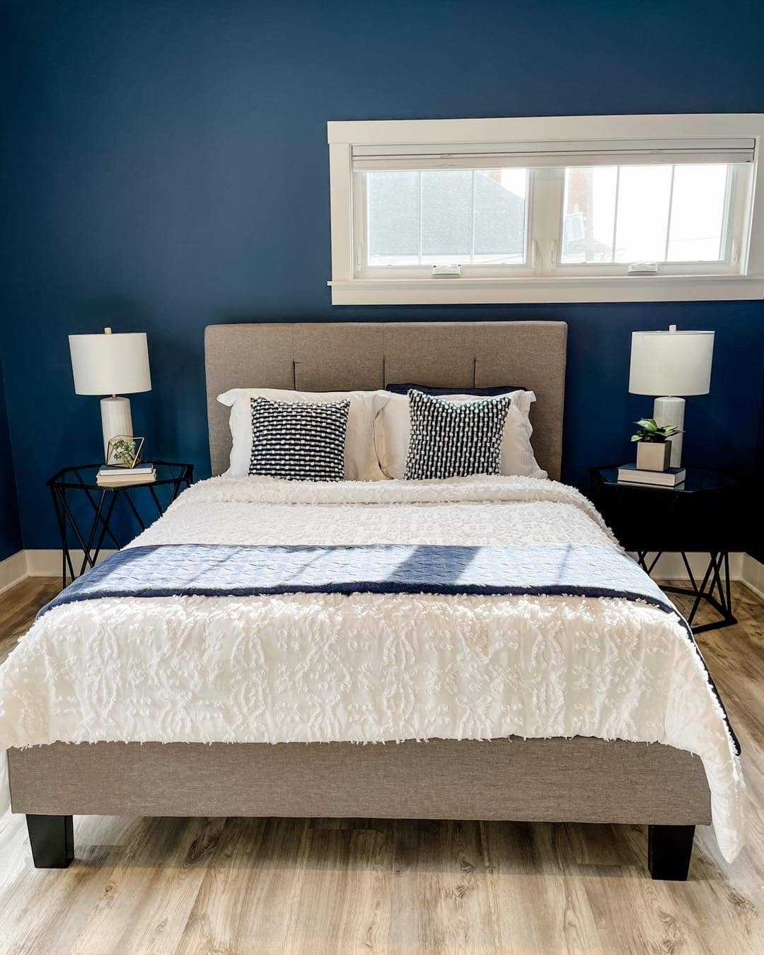 9. Dark Blue Bedroom with Elegant Contrast - blue bedroom ideas