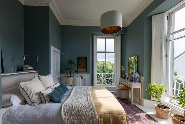 11. Deep Teal Bedroom with Classic Architectural Details - blue bedroom ideas