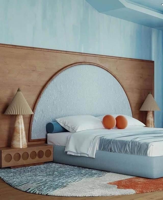 12. Soft Sky Blue Bedroom with Sculptural Wood Headboard - blue bedroom ideas