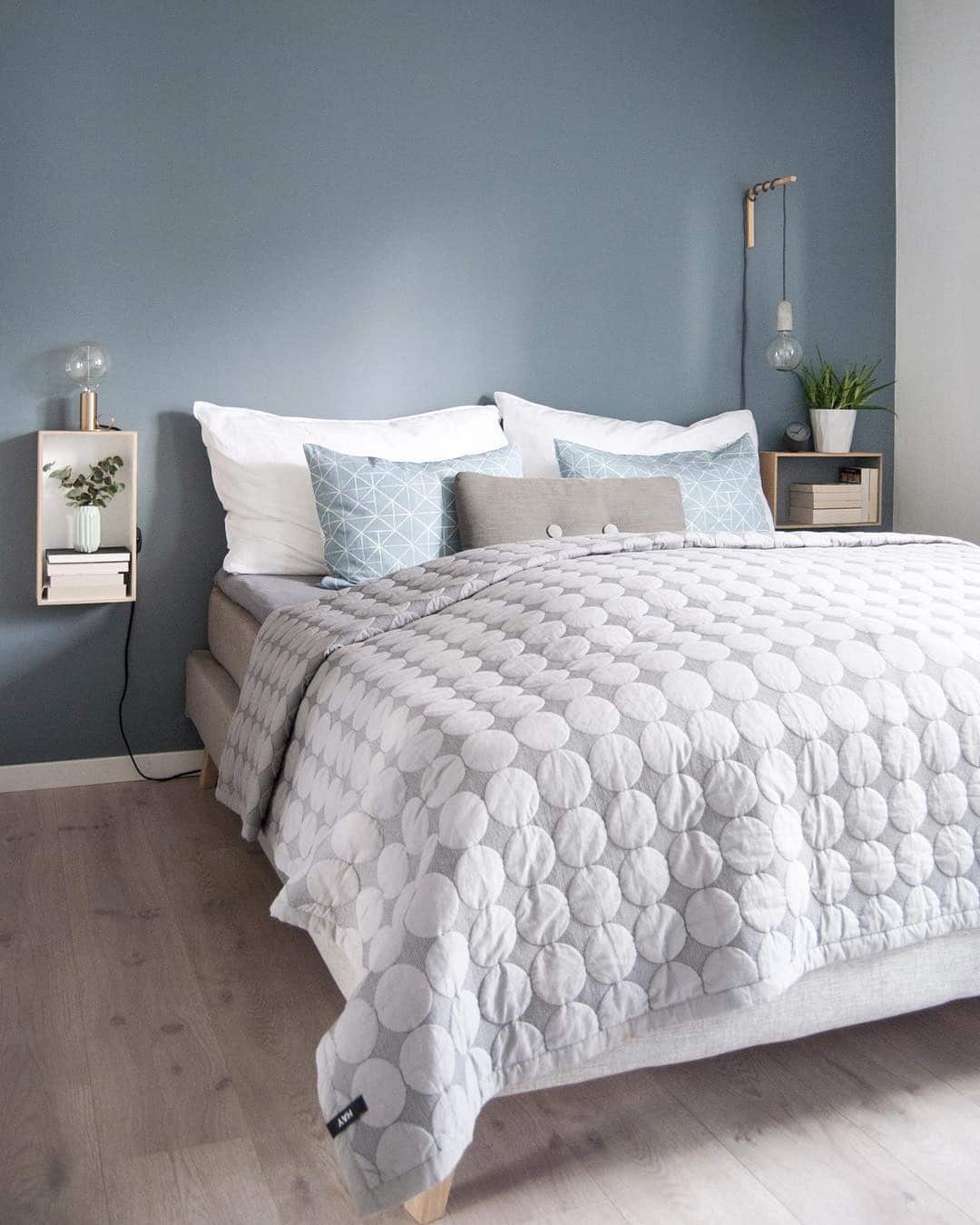 21. Soft Blue Minimal Bedroom with Light Wood Accents - blue bedroom ideas