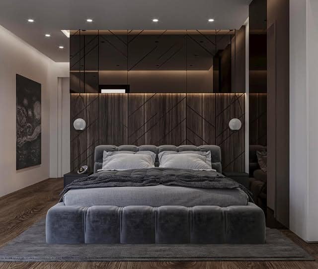 7. Contemporary Grey Bedroom with Reflective Panel Feature Wall - luxury bedroom ideas