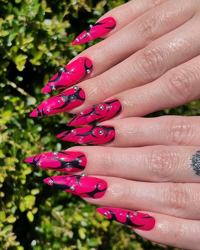 4. Neon Pink and Black Abstract Stiletto Nails with Stud Details - nail ideas with gems