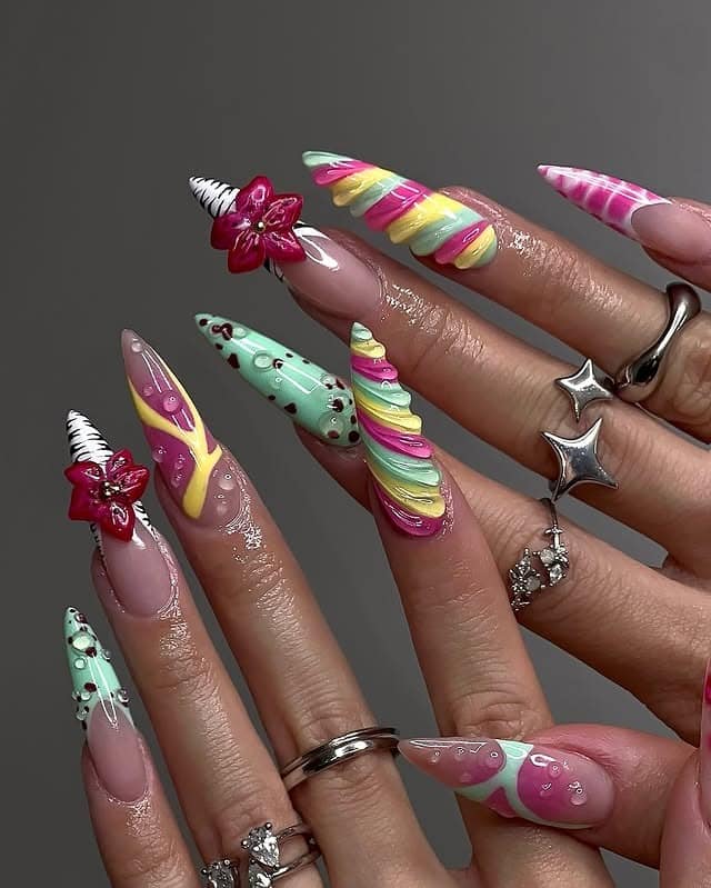 7. Pastel Sculpted Stiletto Nails with 3D Swirls and Floral Gems - nail ideas with gems