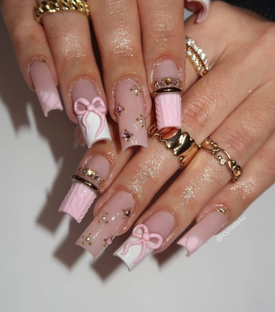 13. Baby Pink Coffin Nails with 3D Bow Art and Gold Gem Details - nail ideas with gems