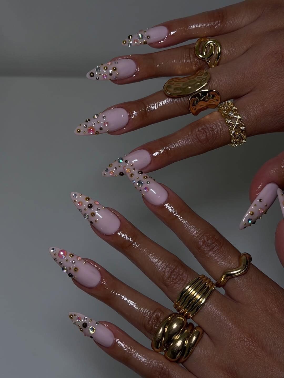 21. Nude Pink Stiletto Nails with Mixed Rhinestone Scatter Design - nail ideas with gems