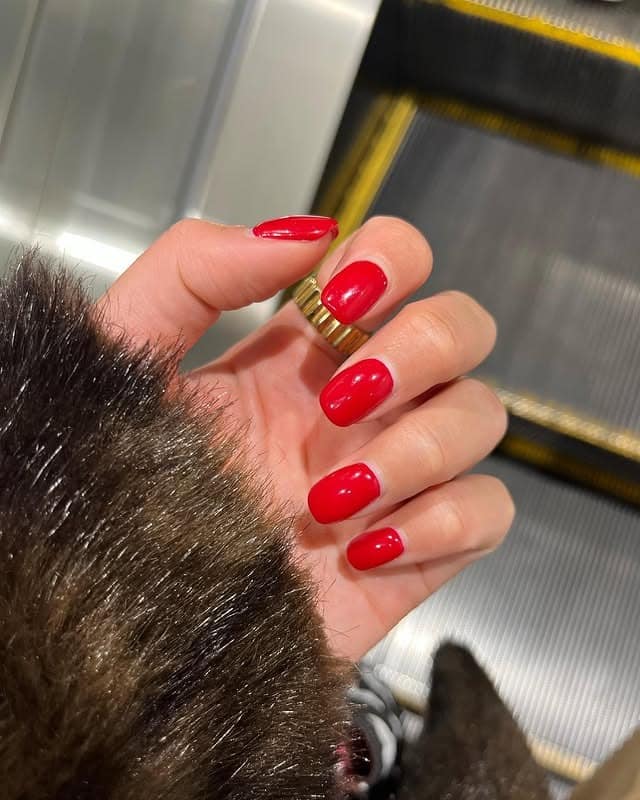 4. Classic Red Short Oval Nails - one color nail ideas