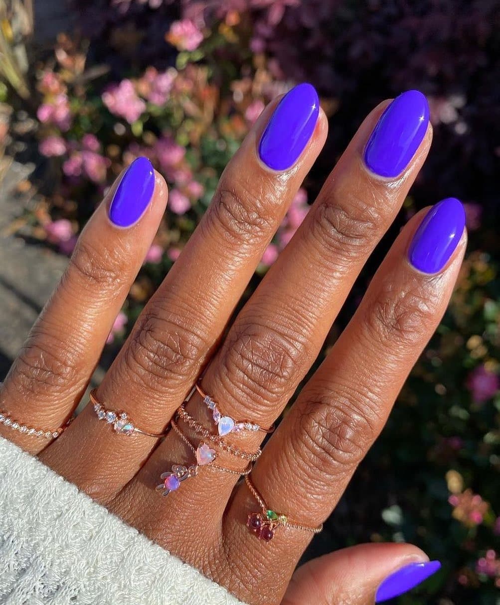 16. Vivid Violet Short Oval Nails - one color nail ideas
