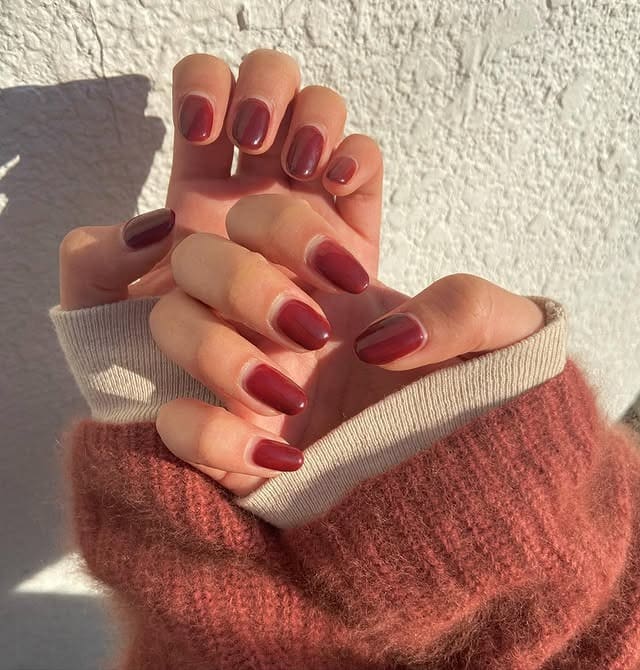 20. Sheer Cranberry Short Oval Nails - one color nail ideas