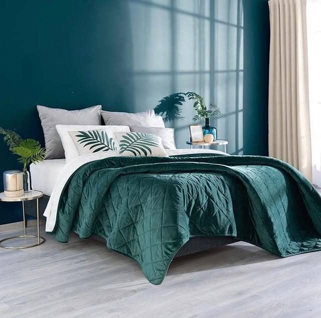 4. Minimal Emerald Wall with Soft Textures - emerald green bedroom ideas