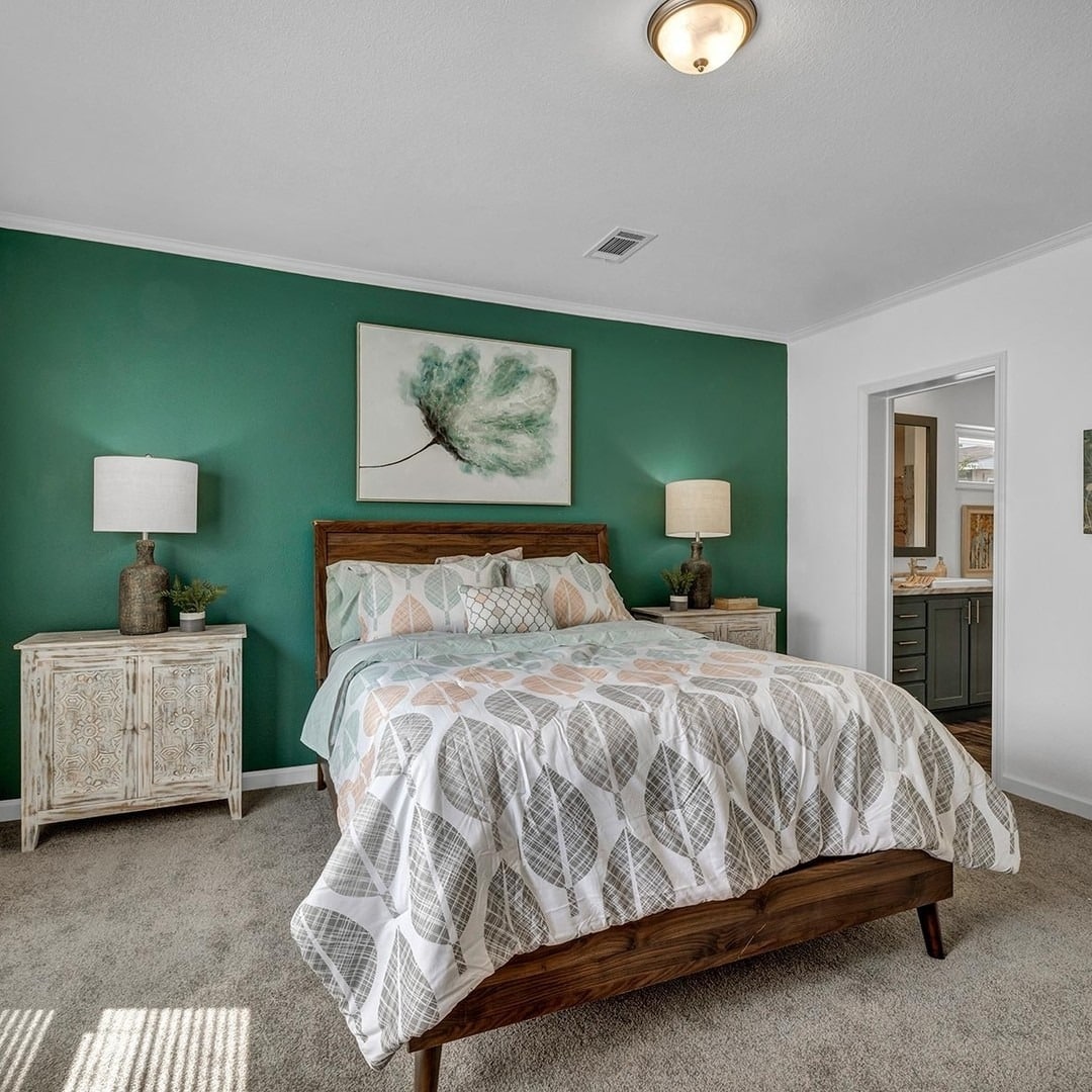 16. Fresh Emerald Accent Wall with Neutral Styling - emerald green bedroom ideas