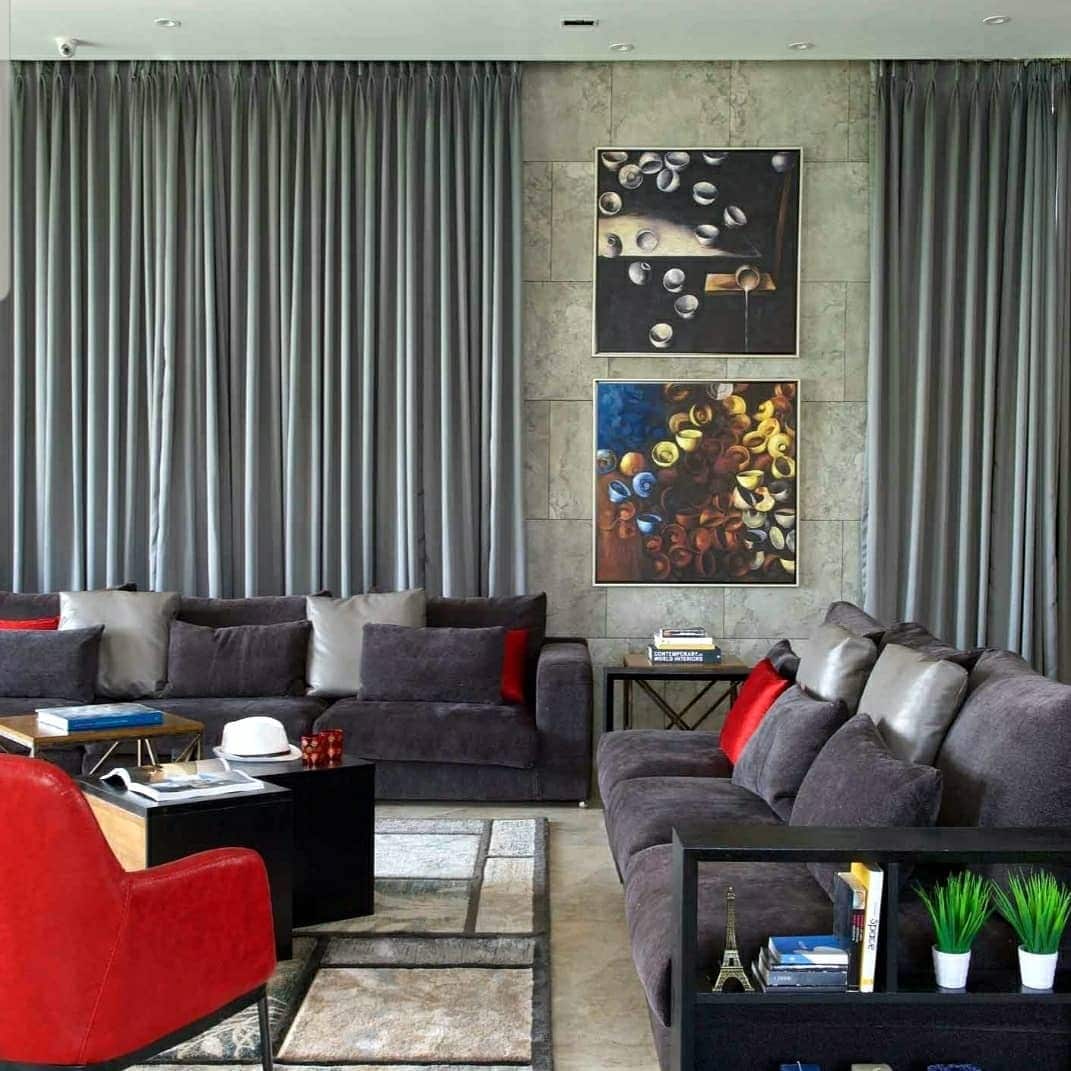 7. Layered Gray Seating with Subtle Red Accents - gray and red living room ideas