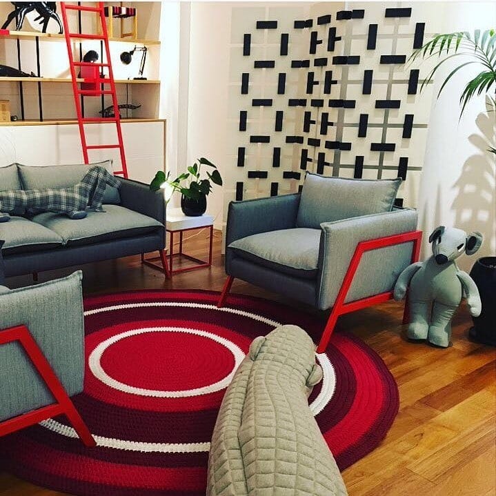 9. Eclectic Living Space with Red Framed Accents - gray and red living room ideas