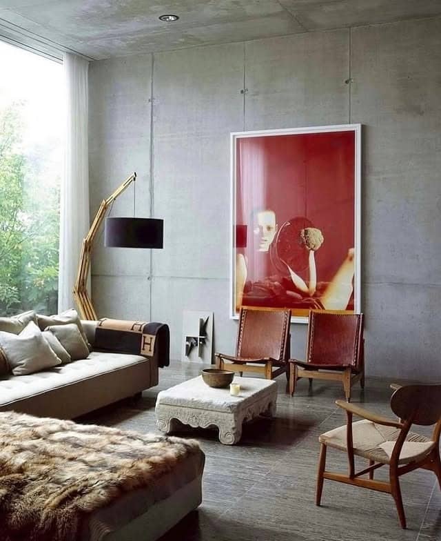 12. Industrial Concrete Living Room with Statement Red Artwork - gray and red living room ideas