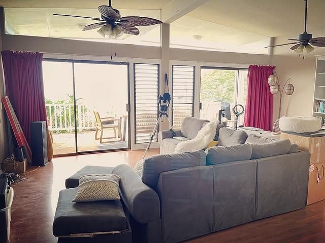 19. Open Living Space with Gray Sectional and Red Curtains - gray and red living room ideas