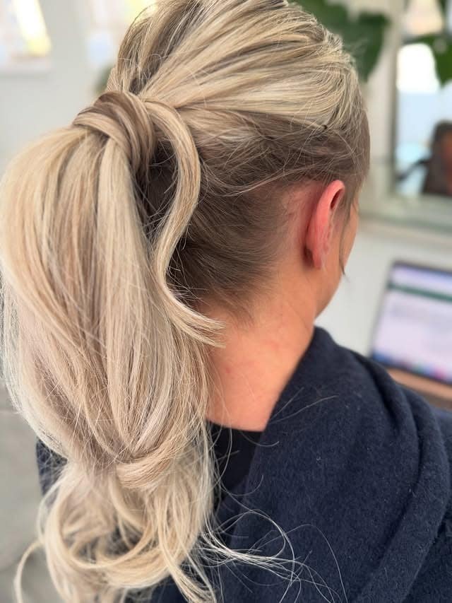 1. Soft Blonde Wrapped Layered Ponytail - Layered Ponytail Hairstyles