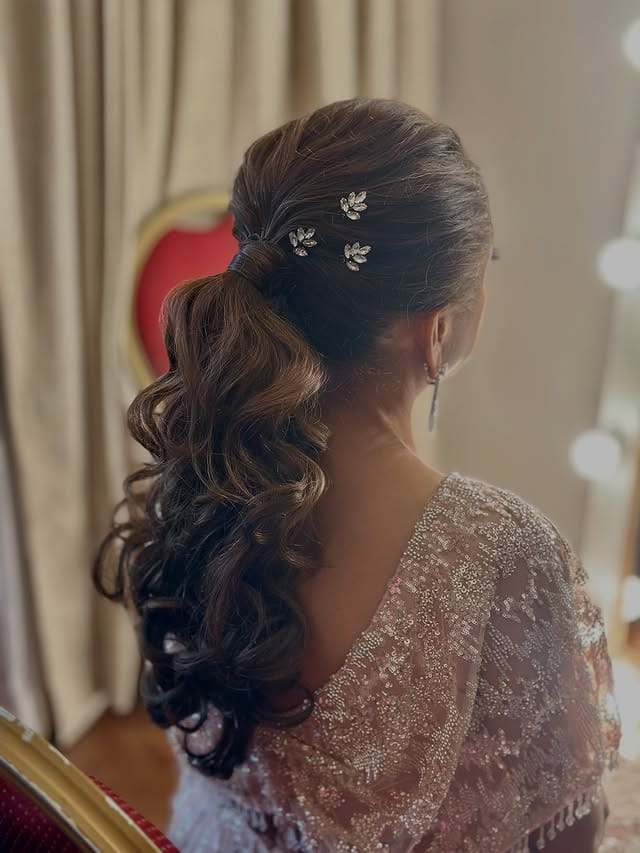 2. Romantic Brunette Layered Ponytail with Hair Accessories - Layered Ponytail Hairstyles