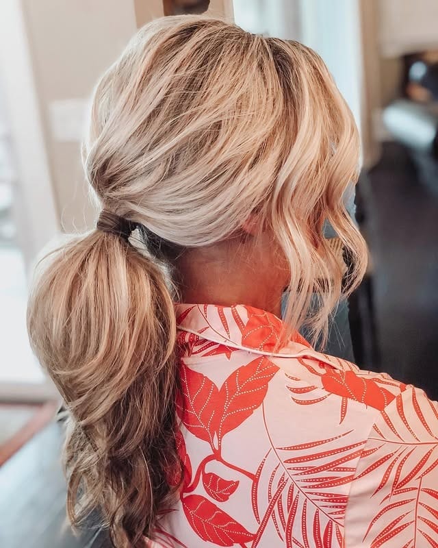 5. Voluminous Blonde Low Layered Ponytail with Face-Framing Pieces - Layered Ponytail Hairstyles