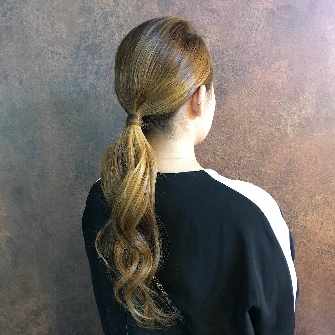 6. Sleek Light Brown Minimal Layered Ponytail - Layered Ponytail Hairstyles