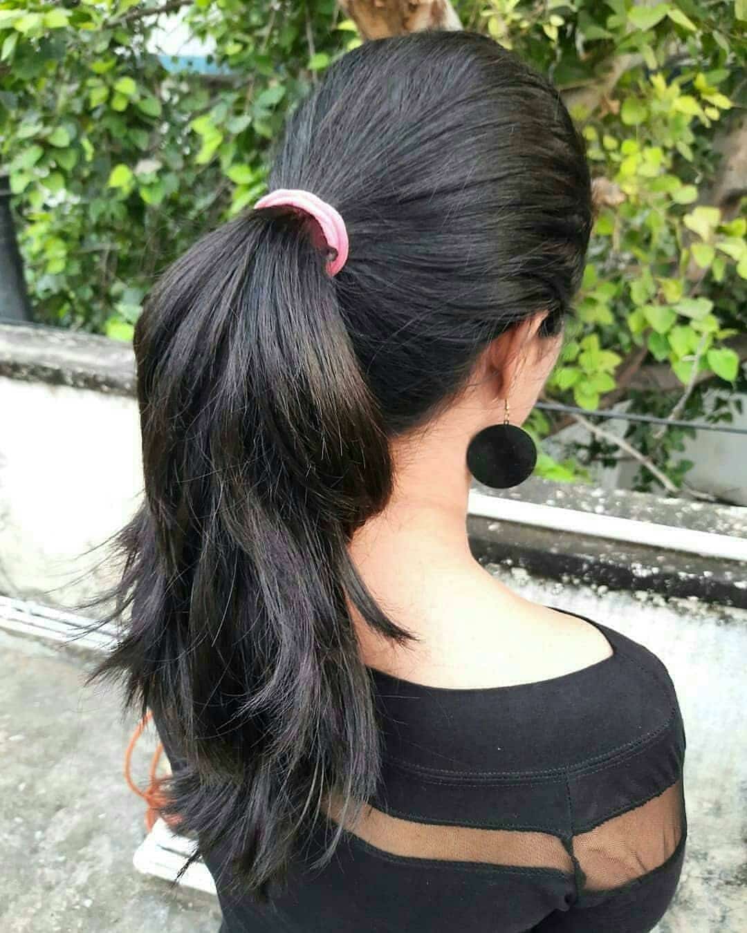 7. Glossy Black High Layered Ponytail - Layered Ponytail Hairstyles