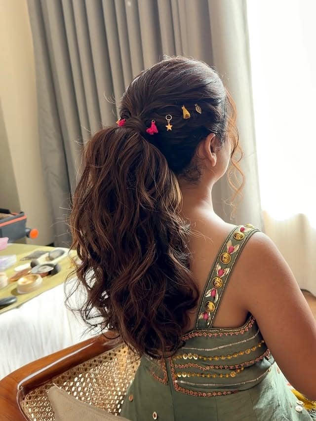 11. Soft Brown Layered Ponytail with Decorative Pins - Layered Ponytail Hairstyles