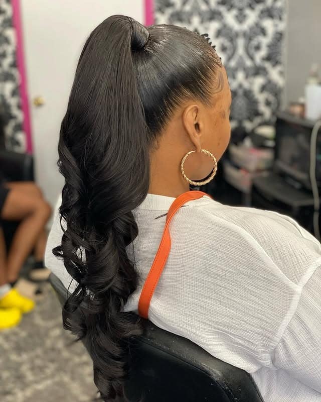 14. Jet Black High Layered Ponytail with Defined Curls - Layered Ponytail Hairstyles