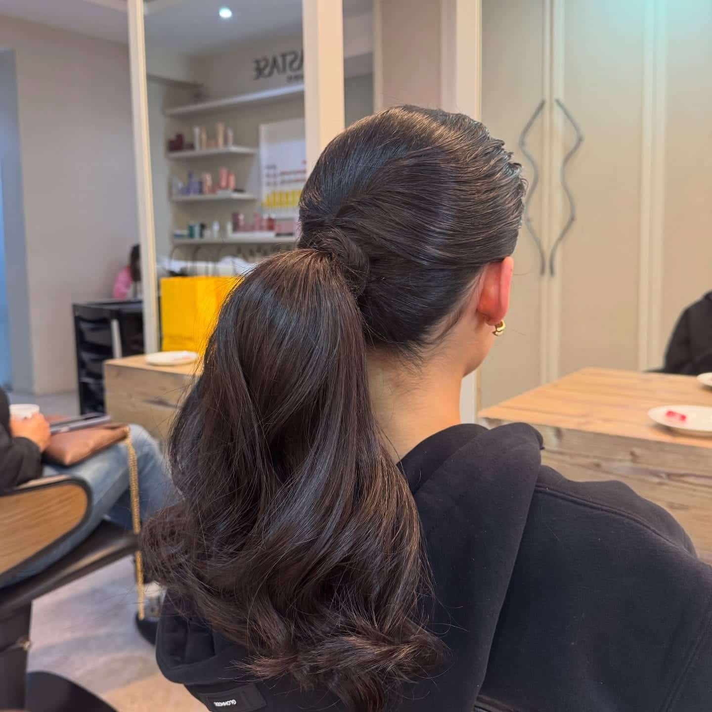 15. Deep Brunette Smooth Layered Ponytail - Layered Ponytail Hairstyles