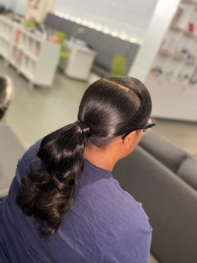 17. Sleek Espresso Wrapped Layered Ponytail - Layered Ponytail Hairstyles