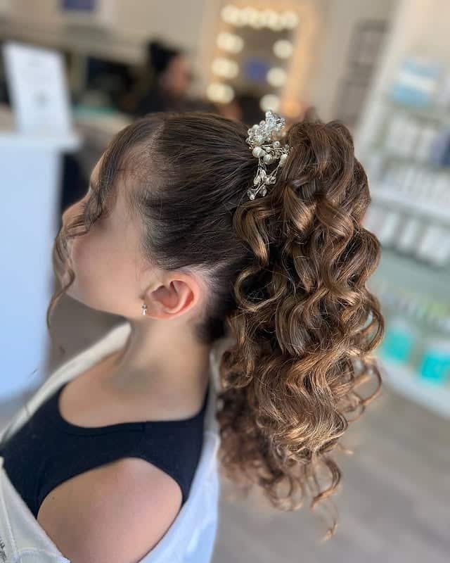 21. Warm Chestnut Curly High Layered Ponytail with Crystal Clip - Layered Ponytail Hairstyles