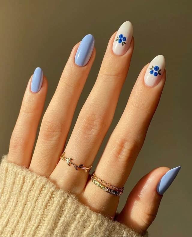 1. Soft Blue Floral Almond Nails - blue spring nail ideas