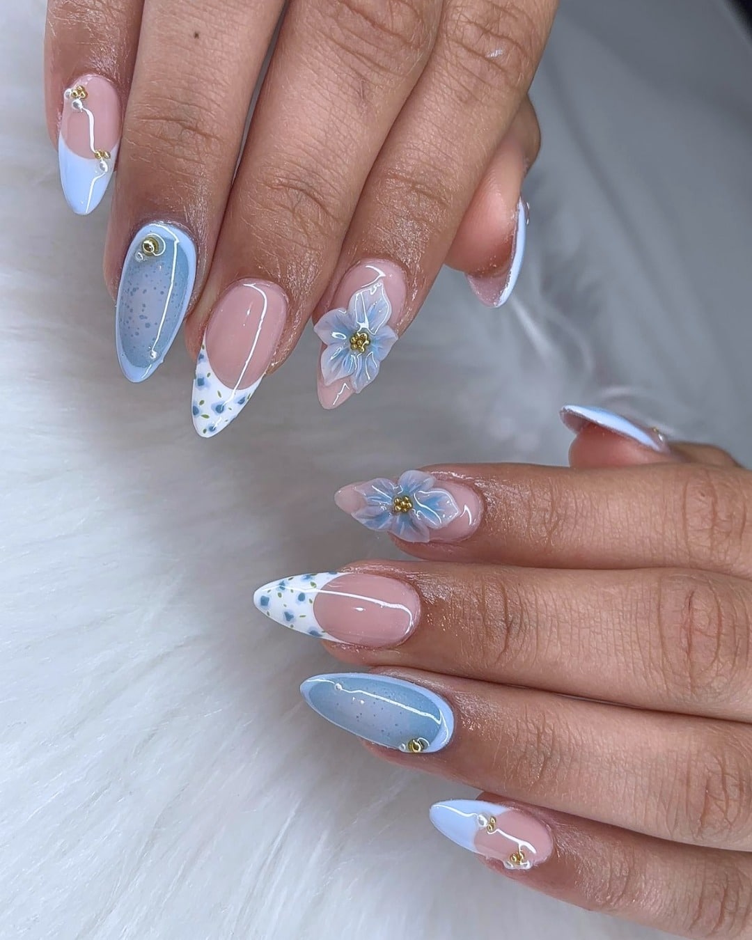 13. Soft Blue 3D Floral Almond Nails - blue spring nail ideas