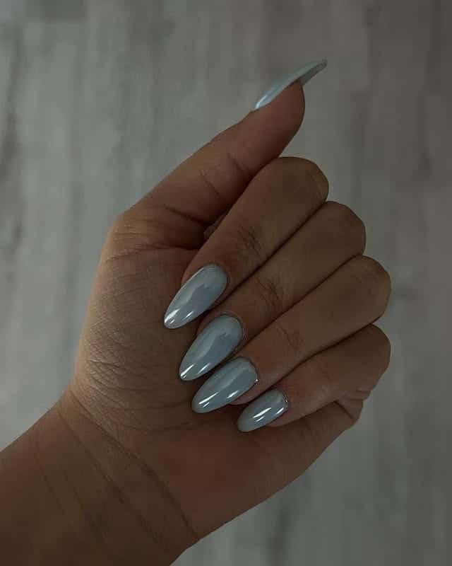 15. Glossy Slate Blue Almond Nails - blue spring nail ideas