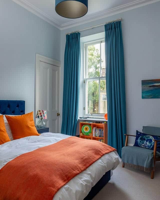 6. Modern Light Blue Bedroom with Vibrant Accents - light blue bedroom ideas