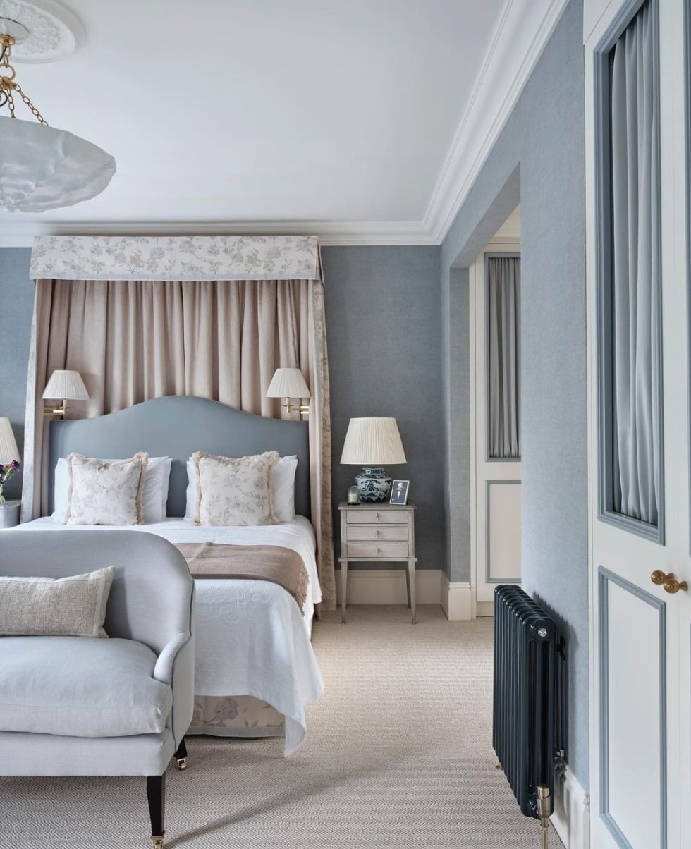 10. Traditional Light Blue Bedroom with Layered Neutrals - light blue bedroom ideas